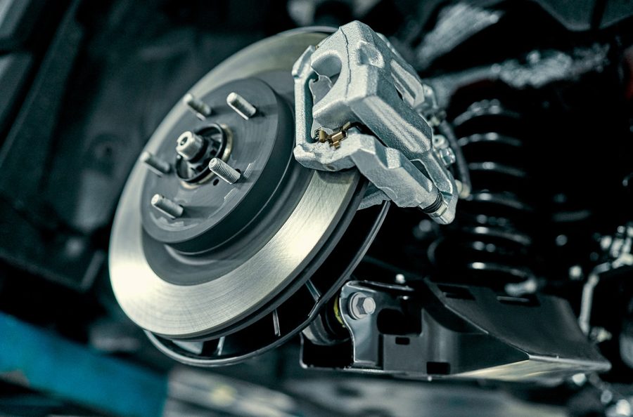 Disc brake and caliper serviced on a vehicle