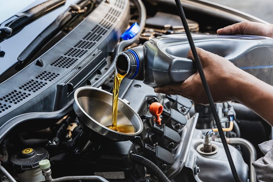 Fresh oil being poured during an oil change